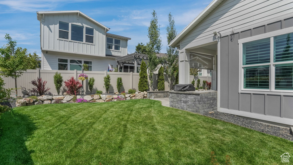View of yard with area for grilling