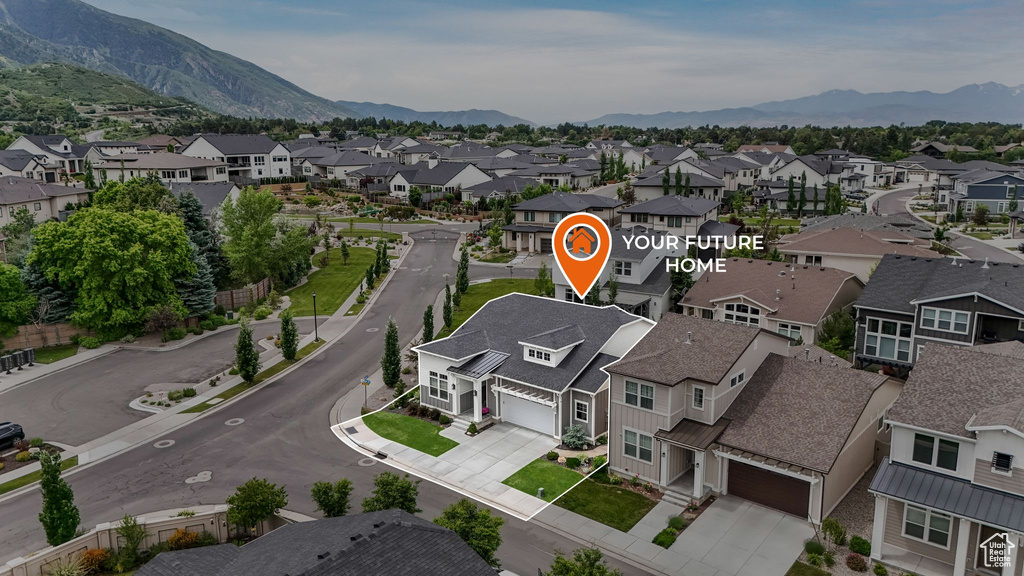 Aerial perspective of suburban area featuring a mountainous background