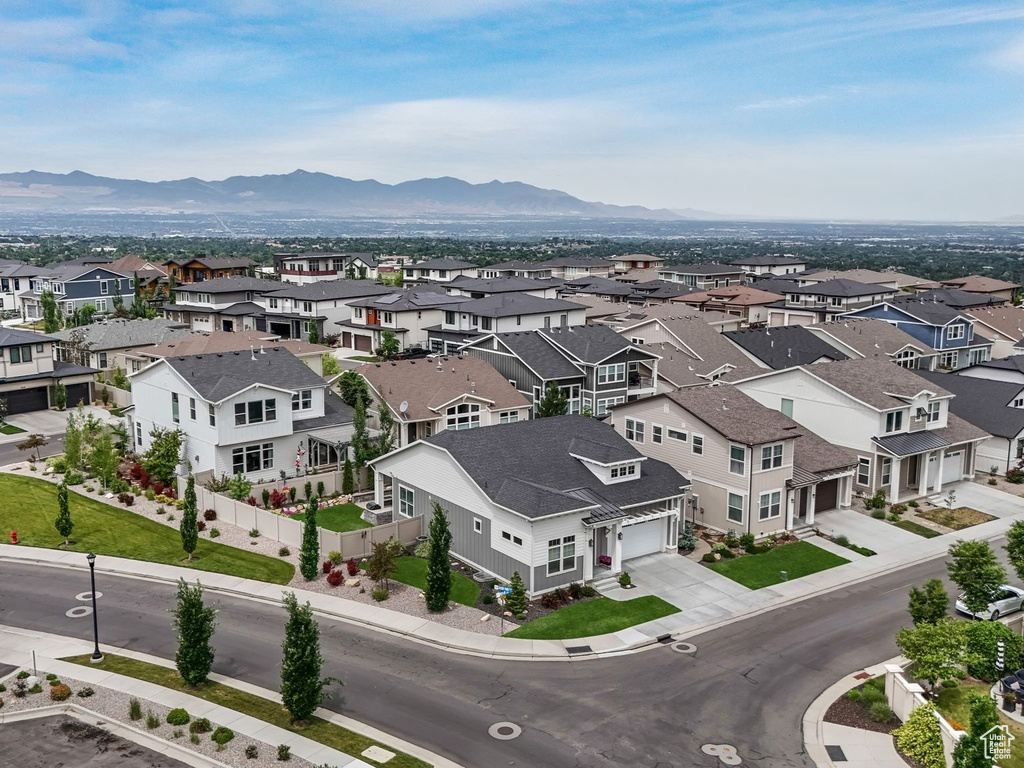 Aerial perspective of suburban area featuring a mountainous background