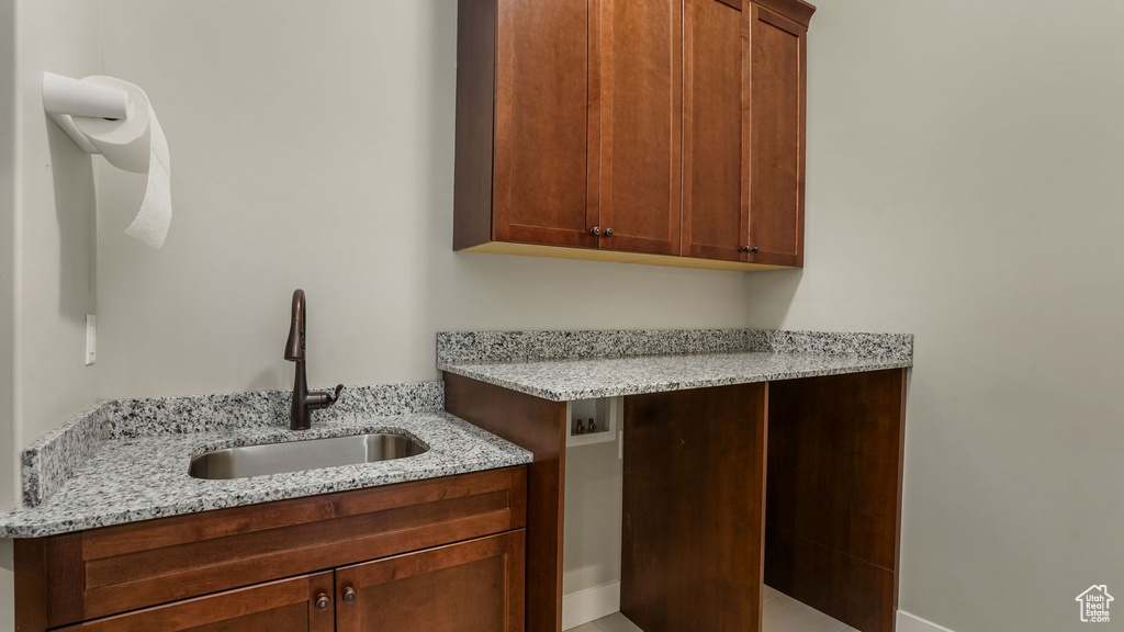 Laundry room featuring cabinet space