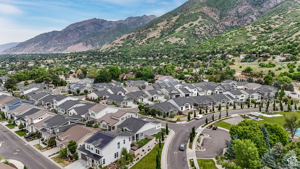 View of property location featuring a mountainous background and nearby suburban area