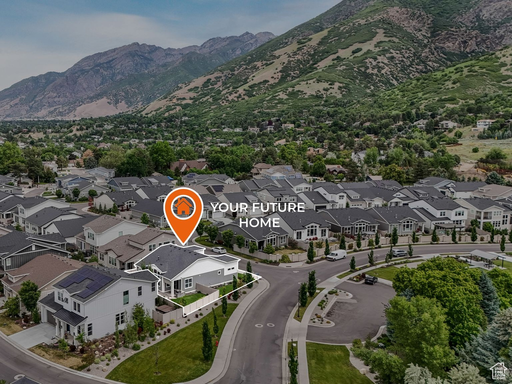 View of property location featuring nearby suburban area and a mountainous background