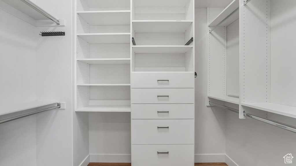 Walk in closet featuring wood finished floors