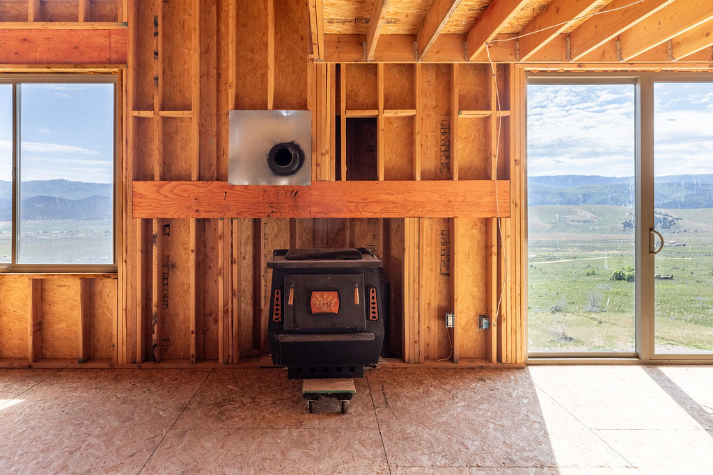 Detailed view of a wood stove and mountains