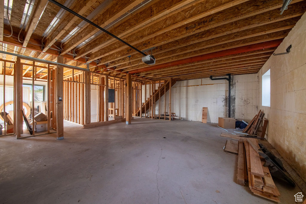 Misc room featuring unfinished concrete flooring