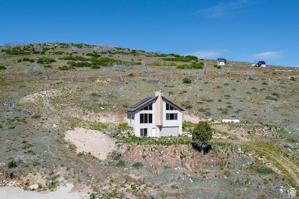 View of side of home featuring a view of rural / pastoral area
