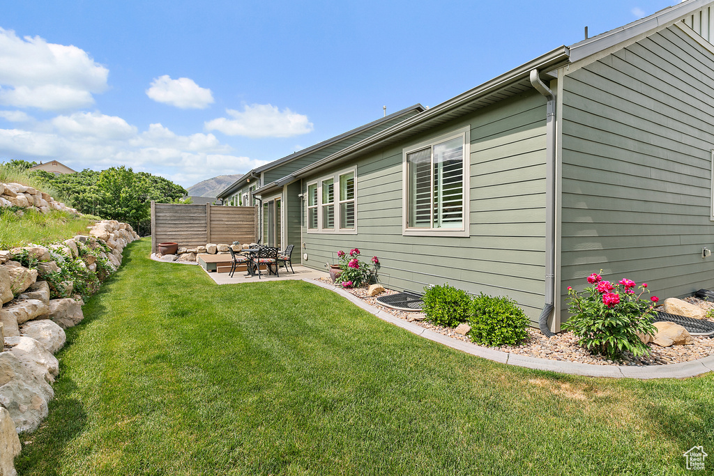 View of yard with a patio area