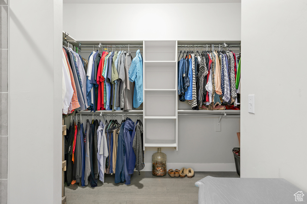 Spacious closet with wood finished floors