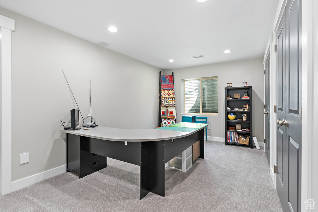 Office space featuring light colored carpet, recessed lighting, and baseboards
