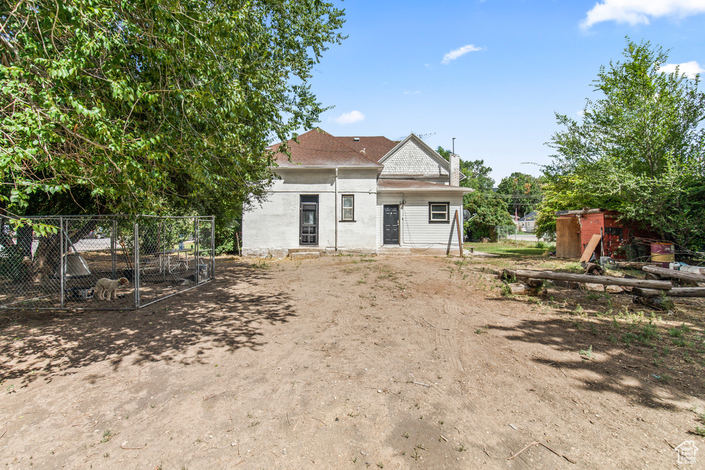 Rear view of house featuring entry steps