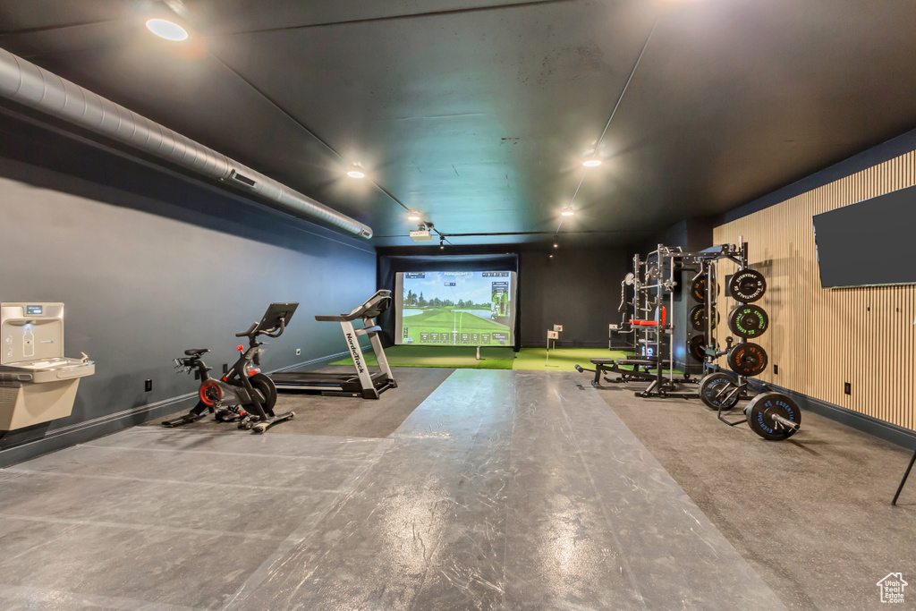 Workout area featuring baseboards