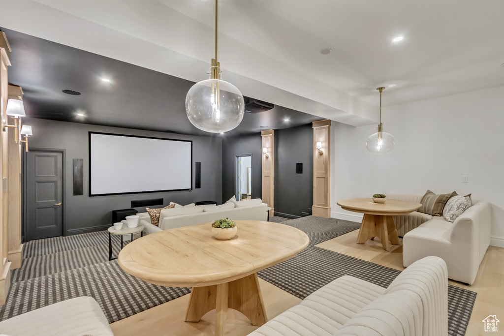 Home theater room with recessed lighting and light wood-style floors