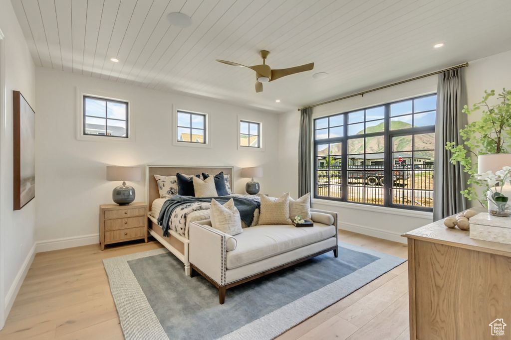 Bedroom with light wood-style floors, recessed lighting, ceiling fan, and wood ceiling