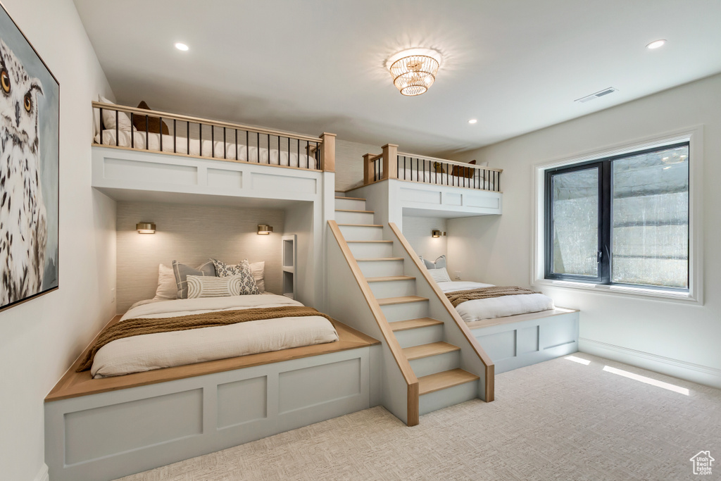 Bedroom with recessed lighting and light colored carpet