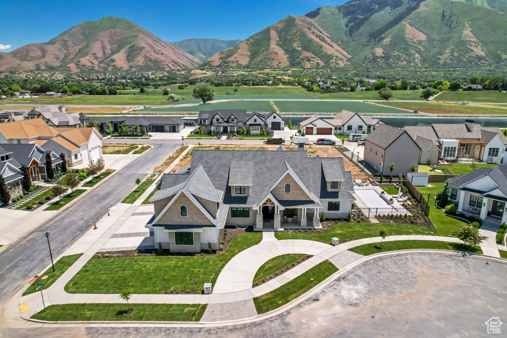 Aerial perspective of suburban area with a mountain backdrop