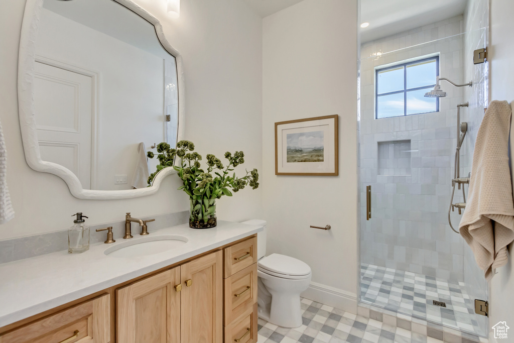 Full bathroom with a stall shower and vanity
