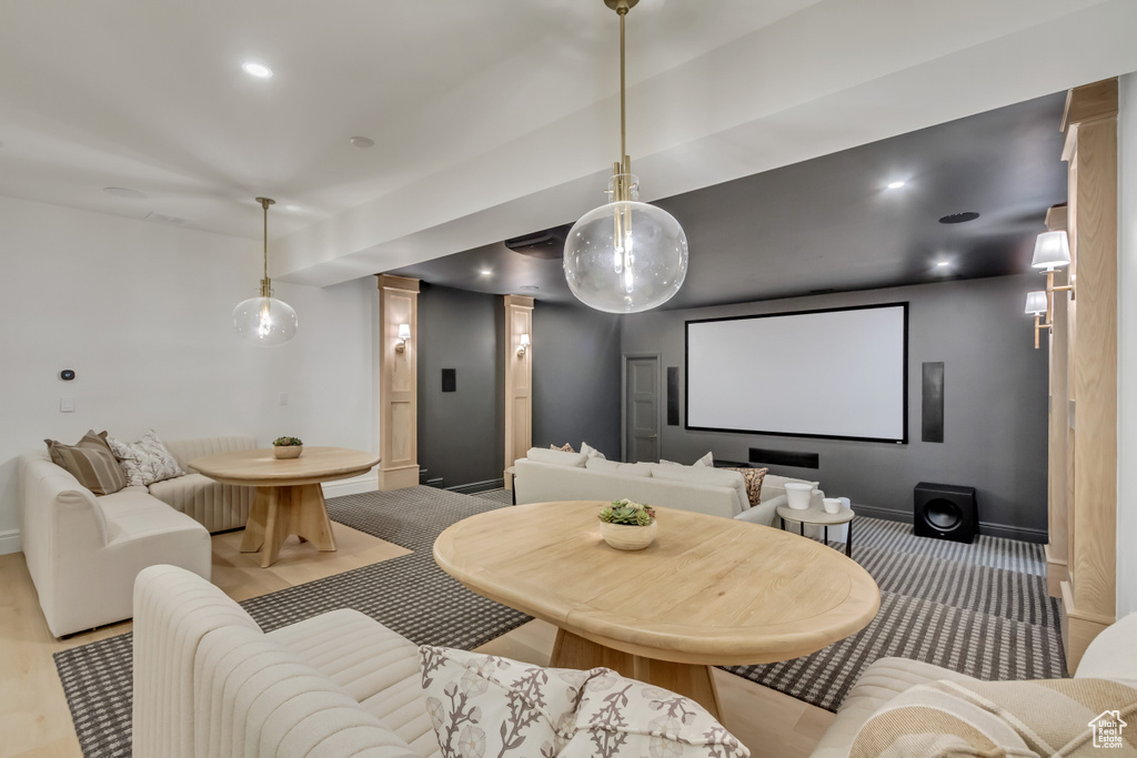 Cinema room with baseboards and recessed lighting