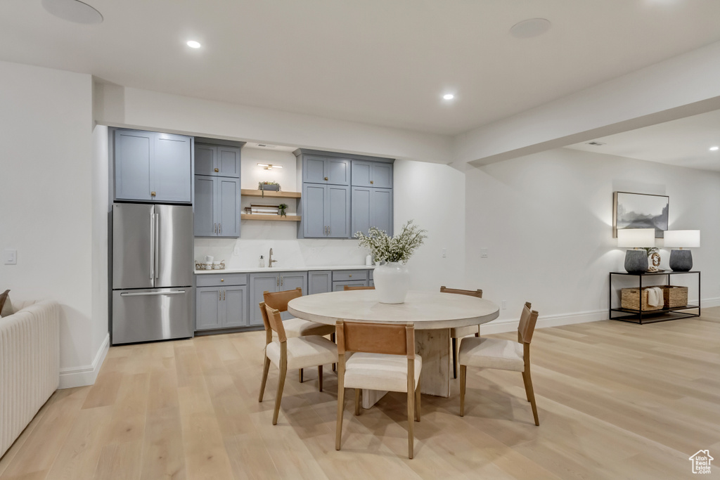 Dining space featuring light wood-type flooring and recessed lighting