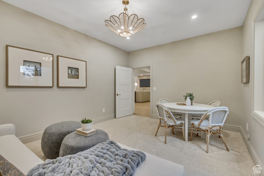 Dining room featuring carpet flooring, a chandelier, and recessed lighting