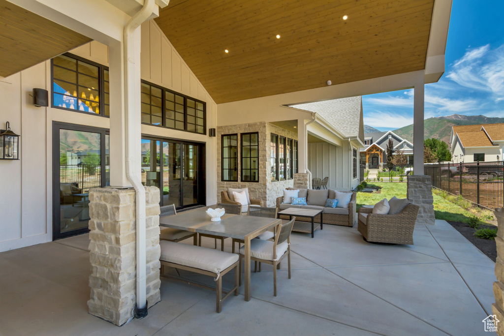 View of patio with a mountain view and an outdoor living space