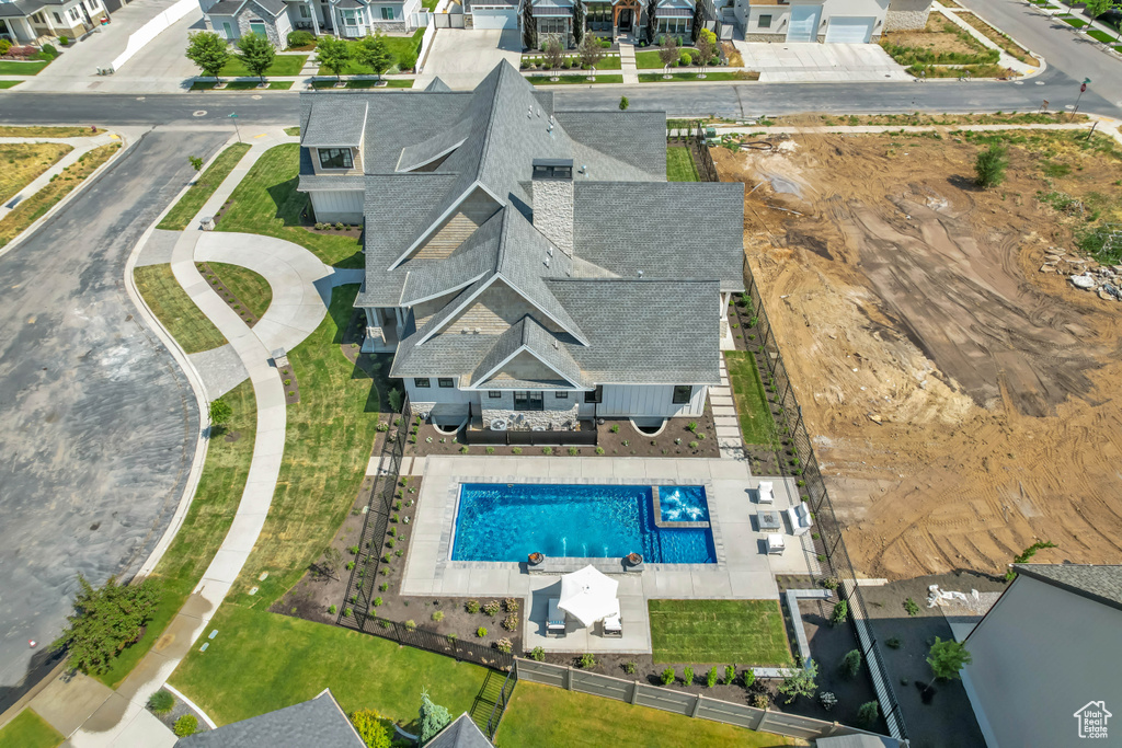 Aerial perspective of suburban area featuring a pool area