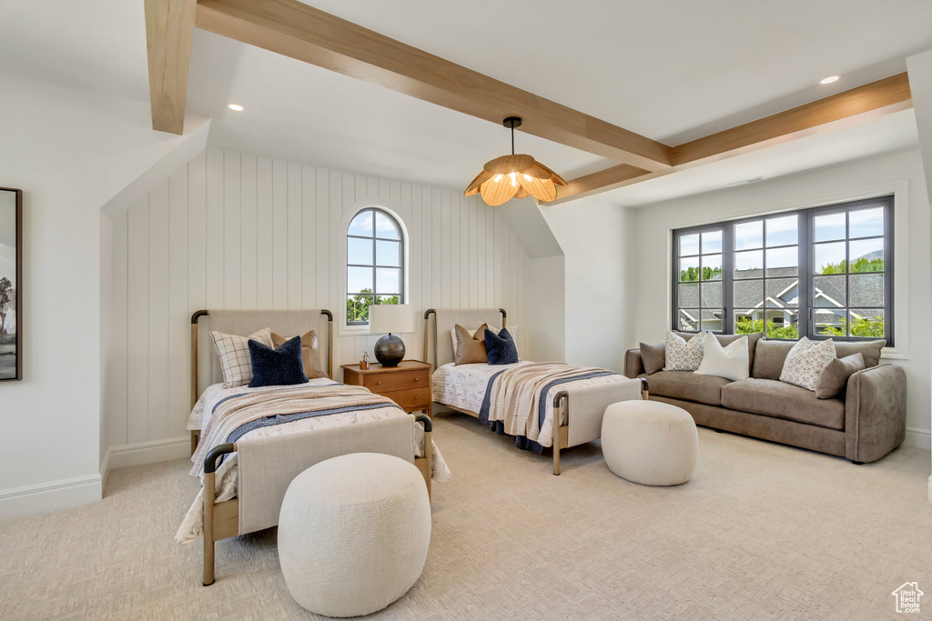 Carpeted bedroom featuring beamed ceiling and recessed lighting
