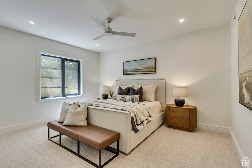 Bedroom featuring recessed lighting, ceiling fan, and light carpet