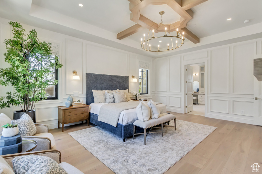 Bedroom featuring a decorative wall, a chandelier, light wood-type flooring, beamed ceiling, and recessed lighting