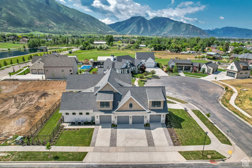 Aerial perspective of suburban area with a water and mountain view