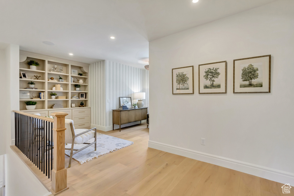 Hall featuring light wood-style flooring and recessed lighting