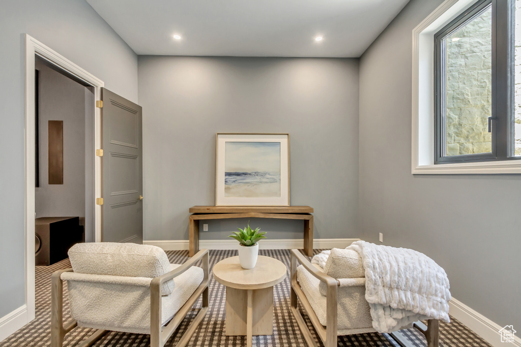 Sitting room featuring baseboards and recessed lighting
