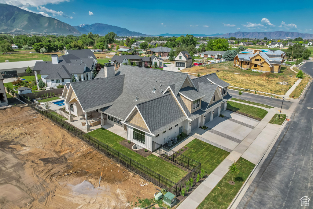 Aerial view of residential area featuring a mountain backdrop