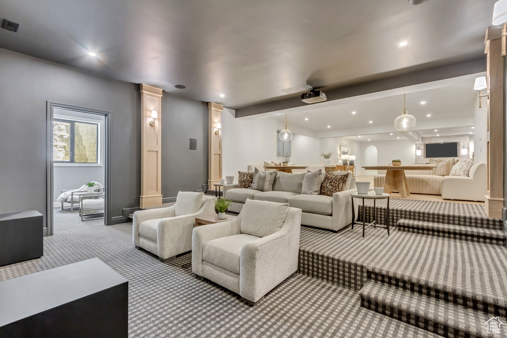 Carpeted home theater featuring recessed lighting and decorative columns