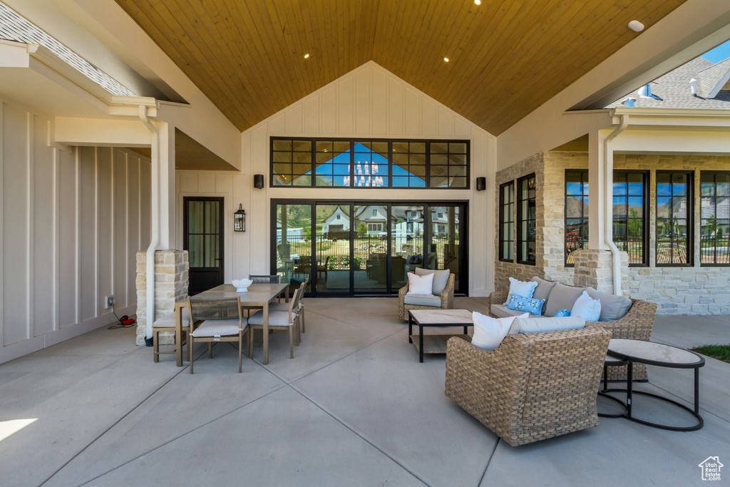 View of patio featuring an outdoor living space and outdoor dining space
