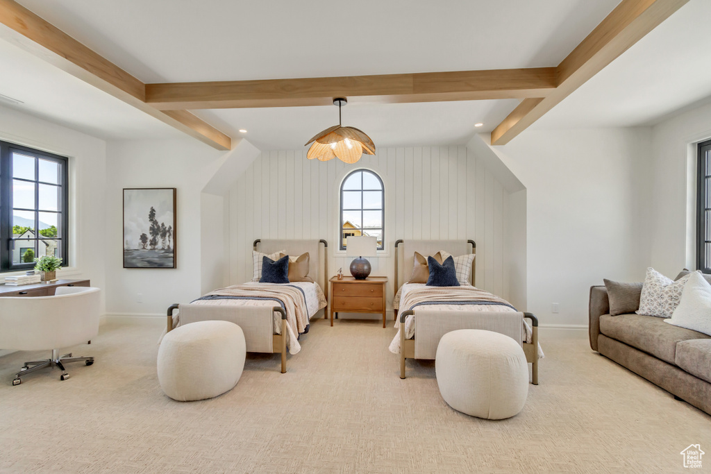 Carpeted bedroom with beamed ceiling