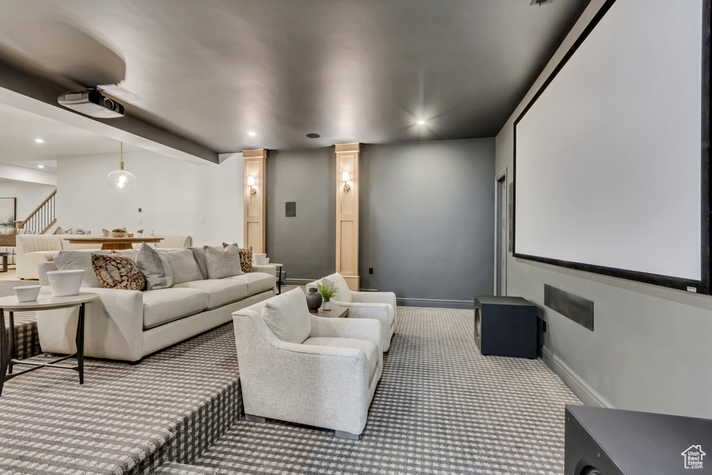 Home theater featuring carpet flooring, ornate columns, and recessed lighting