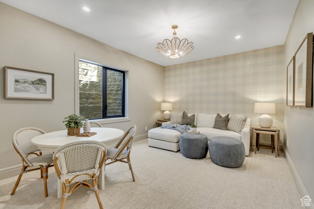 Bedroom with a chandelier, recessed lighting, and light colored carpet