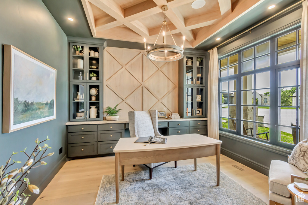 Office with light wood-style floors, coffered ceiling, a chandelier, and beam ceiling