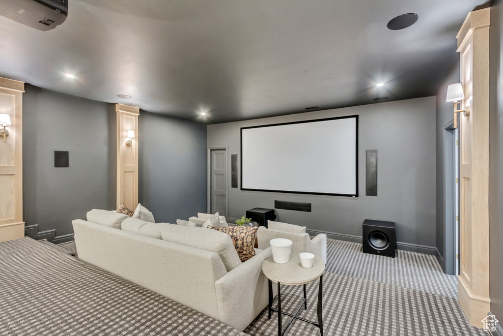 Home theater featuring carpet flooring, recessed lighting, and ornate columns