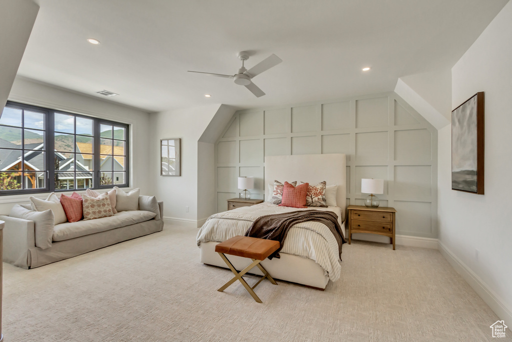 Bedroom with light colored carpet, recessed lighting, and a ceiling fan