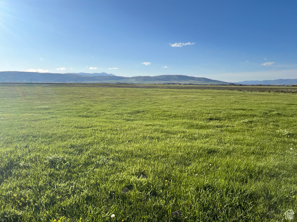 View of mountain backdrop with rural landscape