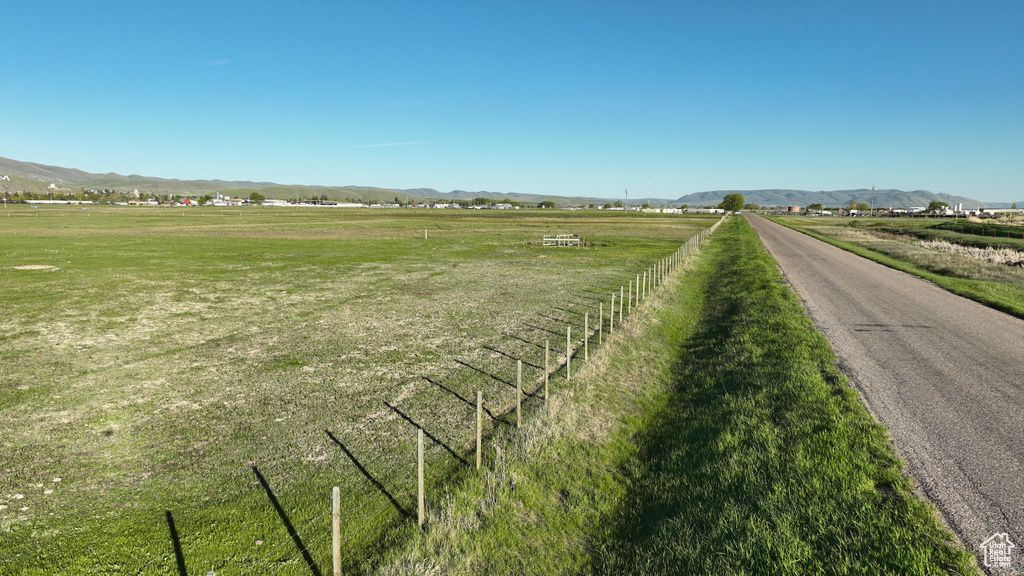 Surrounding community with a rural view and a mountain view