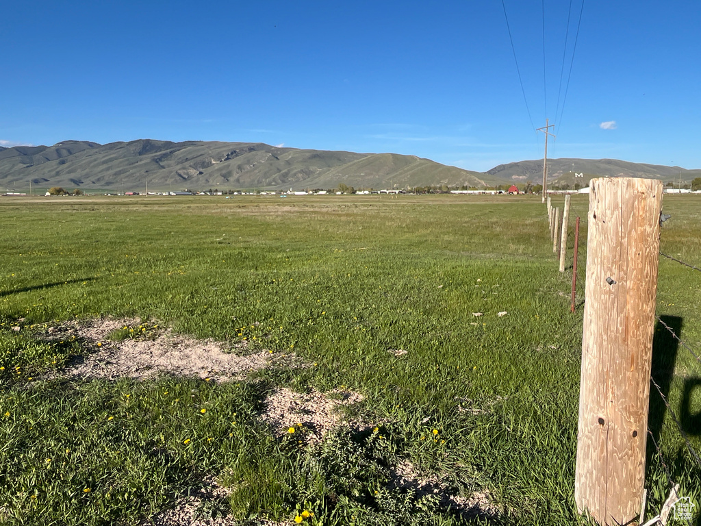 View of mountain background with rural landscape and agricultural land