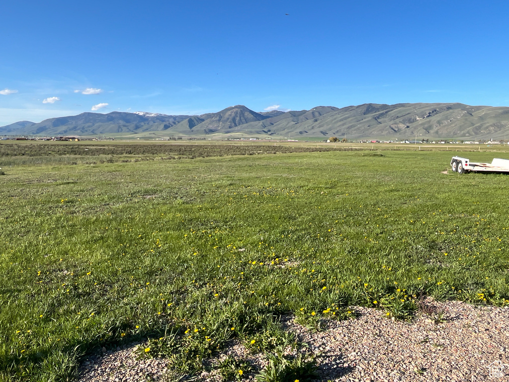 View of mountain backdrop with rural landscape