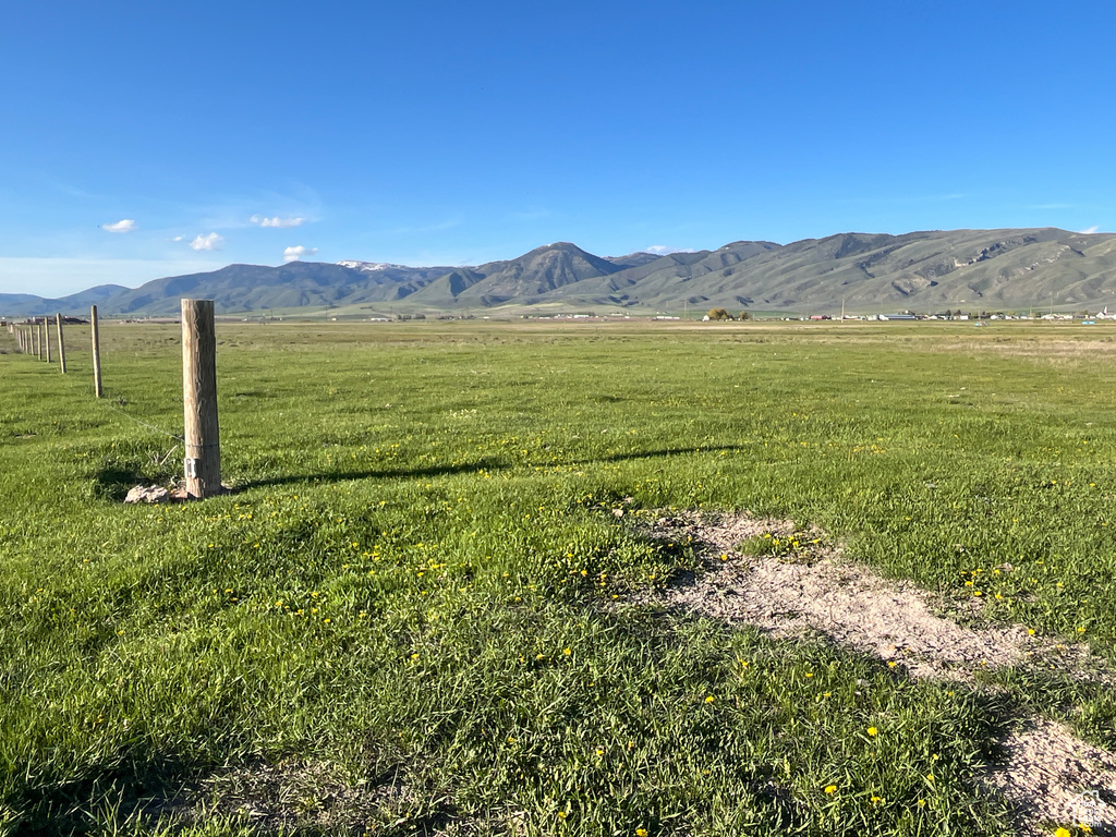 View of mountain backdrop featuring rural landscape and a pastoral area