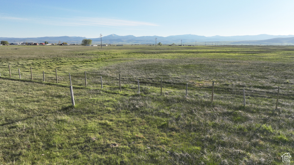 View of mountain backdrop with rural landscape