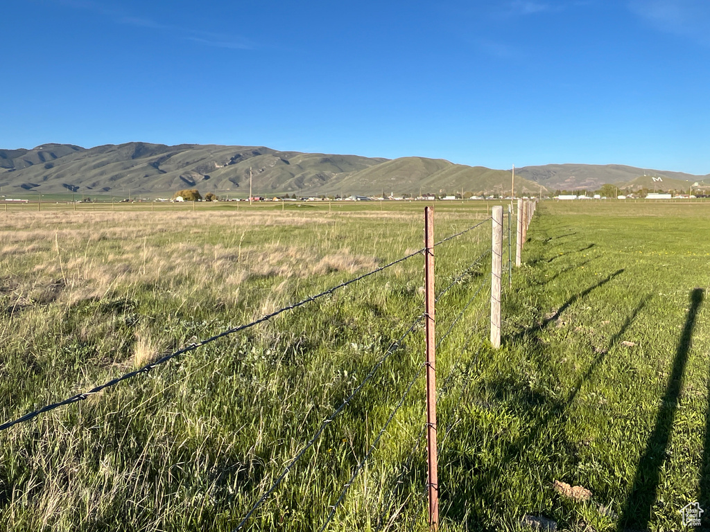 View of mountain background featuring rural landscape and agricultural land