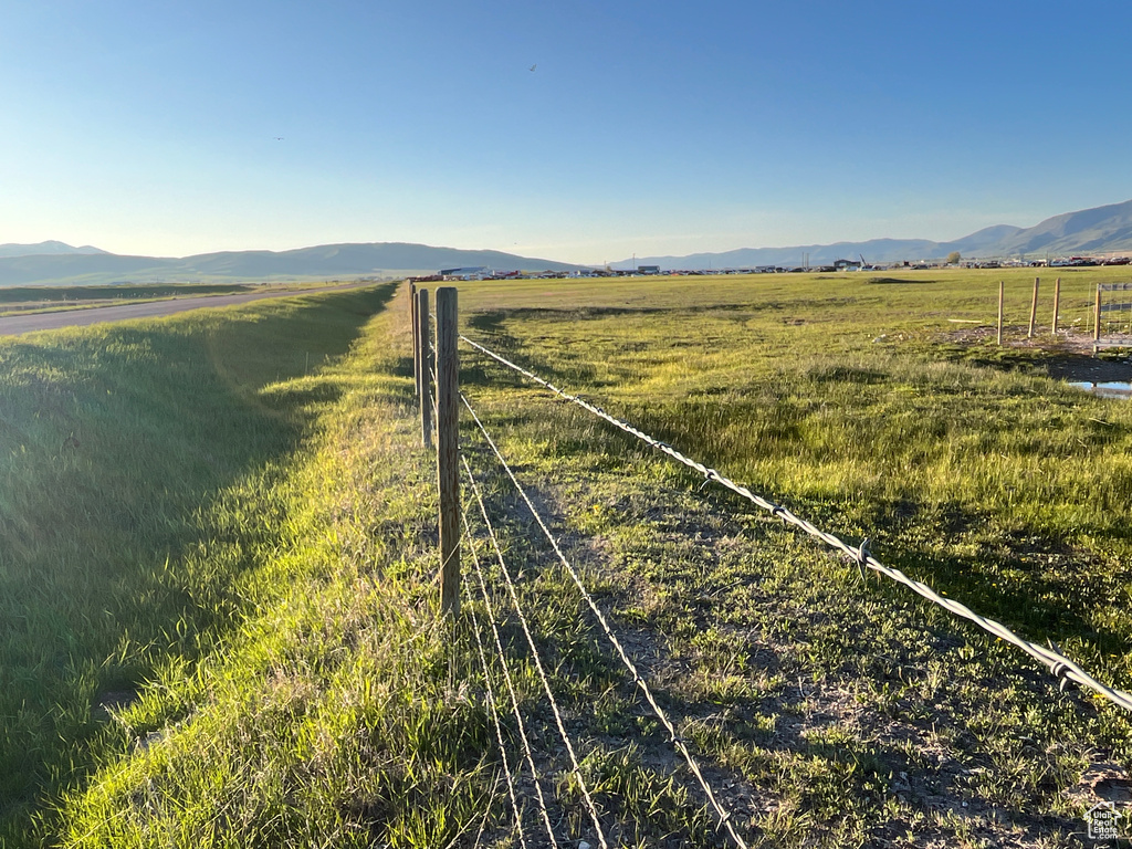 View of yard with a view of countryside and a mountain view
