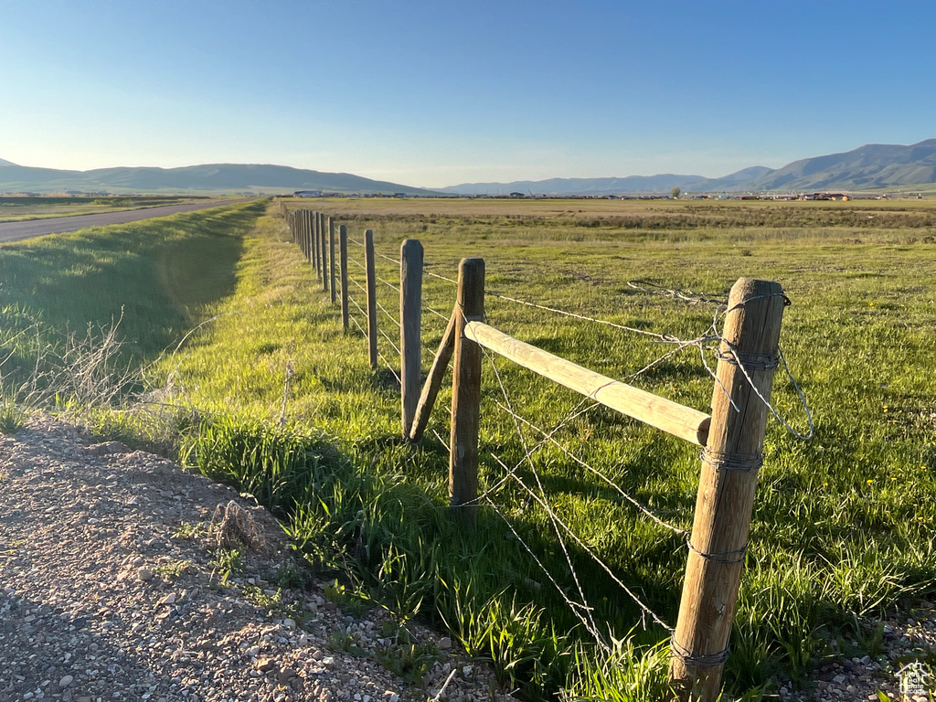 View of mountain backdrop featuring rural landscape