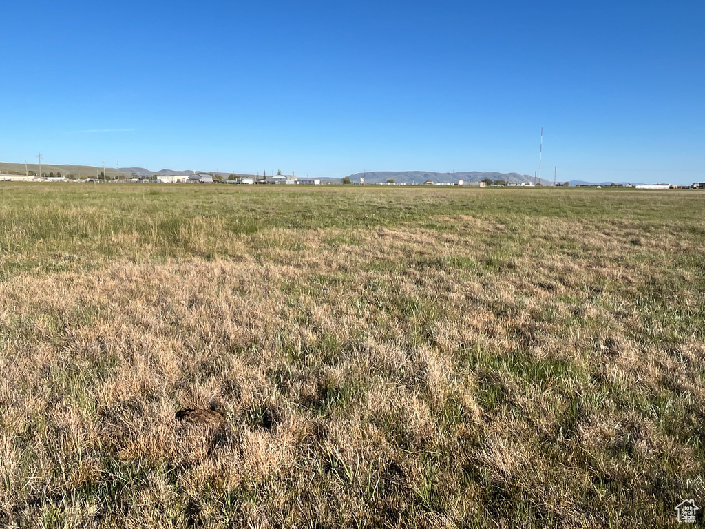 View of undeveloped land featuring rural landscape and a mountain backdrop